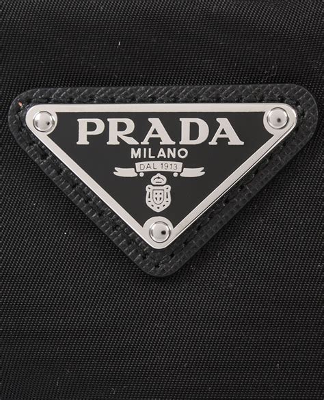 prada triangle badge|prada tag.